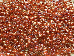 TOHO Round Beads 15/0 - 186 Terra Cotta Lined Luster Crystal (30g Vorteilspack)